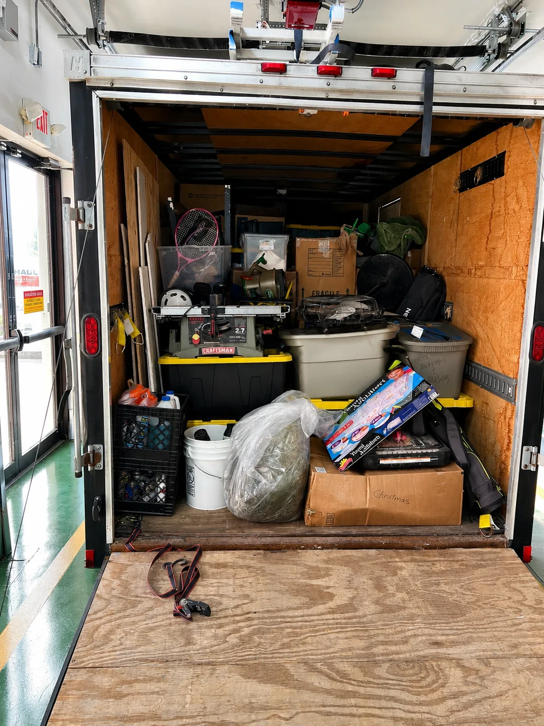 Ancient City Junk Removal trailer loaded during a garage cleanout