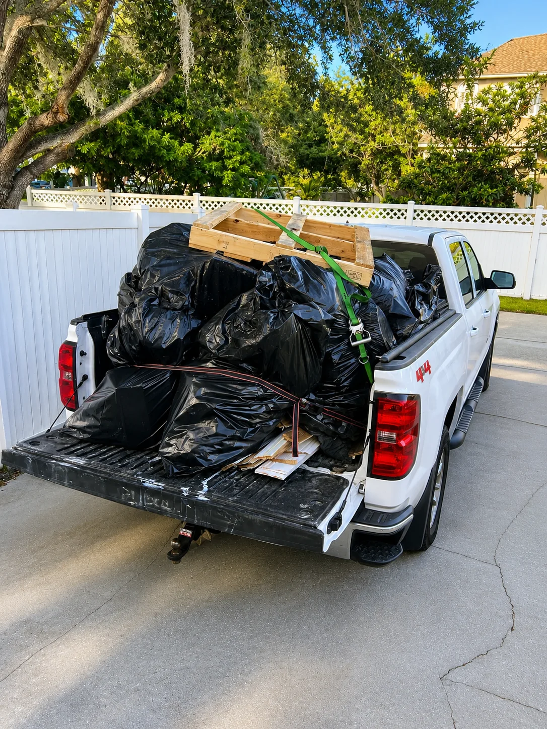 Loaded truck bed ready for junk removal haul